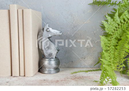 Antique book end on concrete background Antique book end on concrete background 57282253