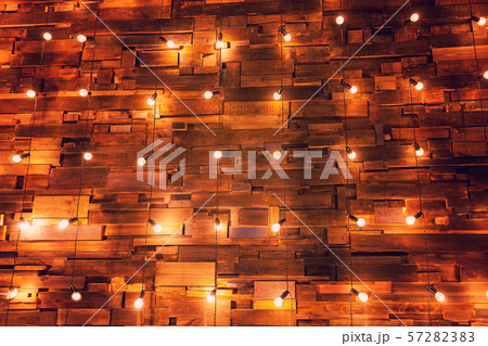 Wooden planks with lamps background. Decorated interior room with gold lights Wooden planks with lamps background. Decorated interior room with gold lights 57282383