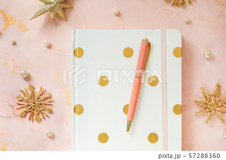 Notepad and pen on a desk workspace, winter 57286360