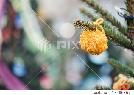 DIY yarn decoration on a Christmas tree DIY yarn decoration on a Christmas tree 57286367