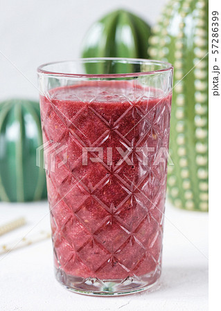 Red beet, blueberry and strawberry smoothie in a glass Red beet, blueberry and strawberry smoothie in a glass 57286399