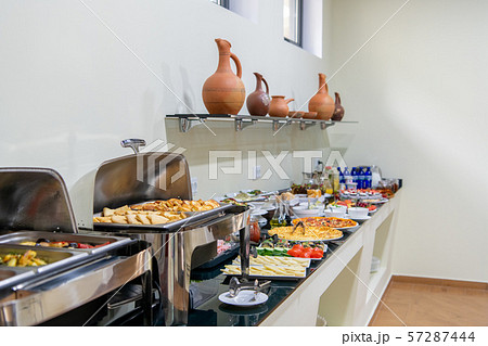 Hotel breakfast board in a family hotel. Buffet with different dishes. Hotel breakfast board in a family hotel. Buffet with different dishes. 57287444