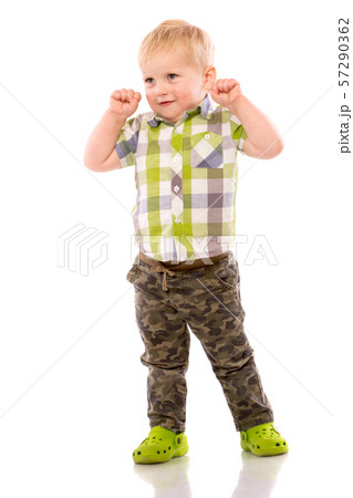 Naughty blonde little boy in shorts and shirt 57290362