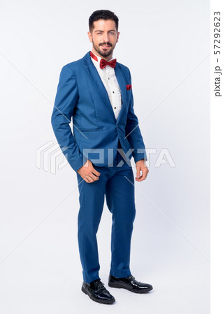 Full body shot of young handsome bearded businessman in blue suit Full body shot of young handsome bearded businessman in blue suit 57292623
