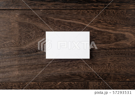top view of white business card on wood floor top view of white business card on wood floor 57293531