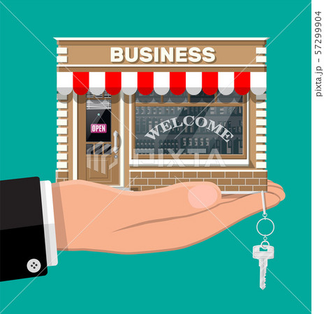Hand holding shop or commercial property with key. 57299904