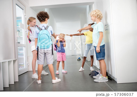 Rude pupils bullying poor little girl in the corridor 57306037