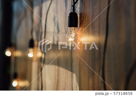 Light bulb decor at wall in outdoor party 57318656