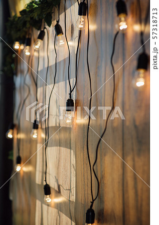 Light bulb decor at wall in outdoor party Light bulb decor at wall in outdoor party 57318713