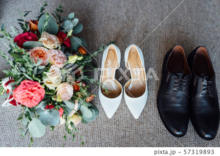 Wedding floristics and details. Wedding invitations on floor. 57319893