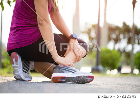 Ankle sprained. Woman suffering from ankle injury 57322545