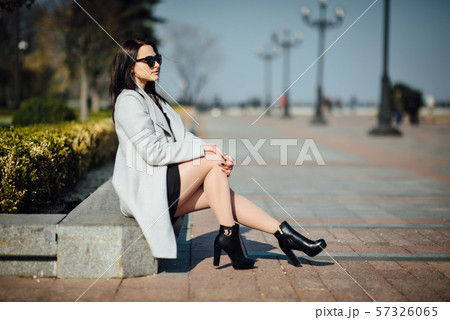 beautiful girl with brunette hair, posing outside, hipster style 57326065