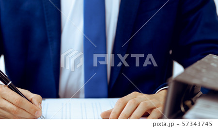 Bookkeeper or financial inspector hands making report, calculating or checking balance. Internal 57343745