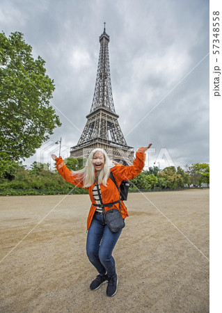 Excited woman by Eiffel Tower in Paris, France 57348558