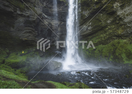 Woman by Kvernufoss waterfall in Iceland 57348729