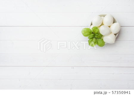 Mozzarella balls and Basil in the dish, selective focus Copy space 57350941