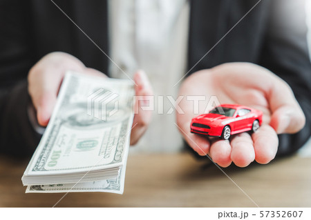 Sale agent giving Car to customer and sign 57352607