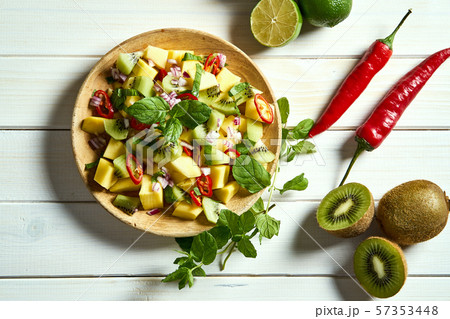 Fresh organic colorful salad of melon with chili on white table 57353448