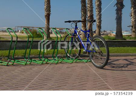 one cyclist is parked on the beach of the Mediterranean coast on a sunny day in Spain, Salou, Europe 57354239