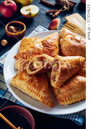 apple turnover on a white plate, vertical view 57354623