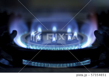 Kitchen gas stove in a kitchen burning gas.  57354651