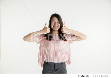 Beautiful girl's half-length portrait on white studio background 57354909
