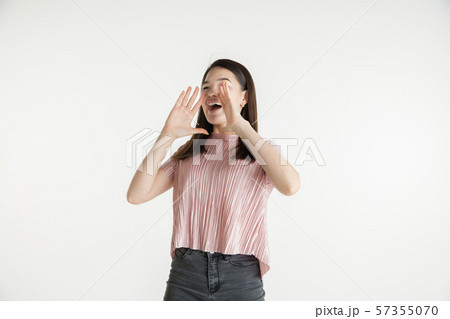 Beautiful girl's half-length portrait on white studio background 57355070