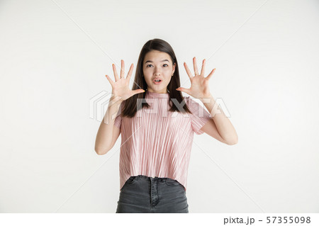Beautiful girl's half-length portrait on white studio background 57355098