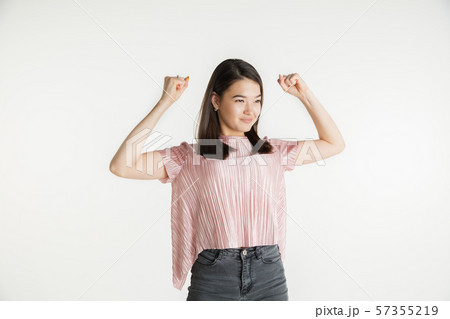 Beautiful girl's half-length portrait on white studio background 57355219