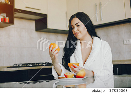 girl in a white dressing gown 57356063