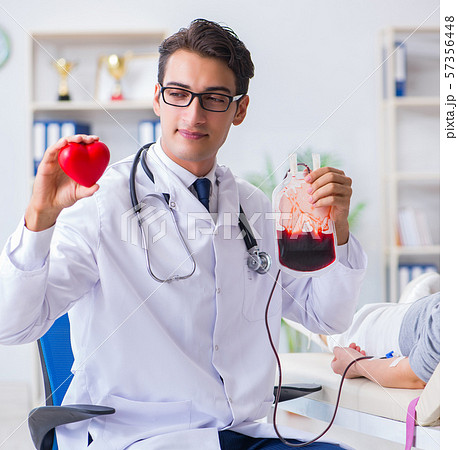 Patient getting blood transfusion in hospital clinic Patient getting blood transfusion in hospital clinic 57356448