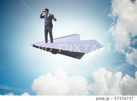 Businessman flying on paper plane in business concept 57356737