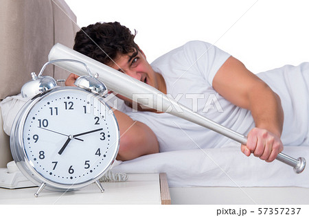 Man in bed suffering from insomnia Man in bed suffering from insomnia 57357237