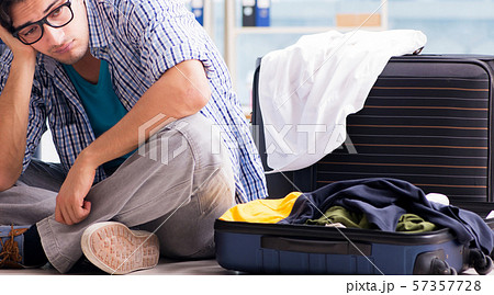 Young man preparing for vacation travel 57357728