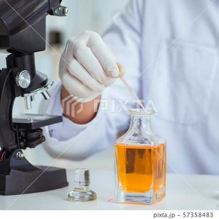 Chemist mixing perfumes in the lab 57358483