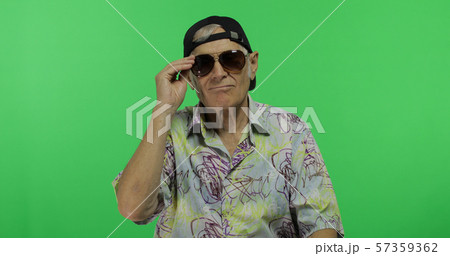 Senior man tourist in sunglasses ready for vacation. Handsome old man Senior man tourist in sunglasses ready for vacation. Handsome old man 57359362