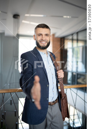 Smiling man getting acquainted with new colleague 57360830