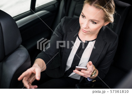Overhead view of businesswoman travelling in the car 57361810