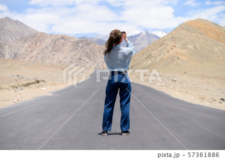 Young woman enjoy her camera in journey 57361886