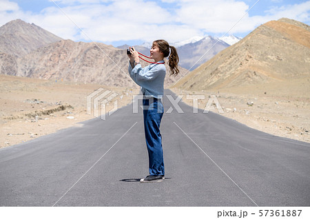 Young woman enjoy her camera in journey 57361887