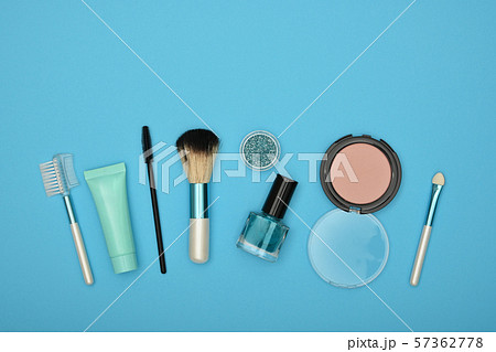 Feminine makeup and beauty care set on blue Feminine makeup and beauty care set on blue 57362778
