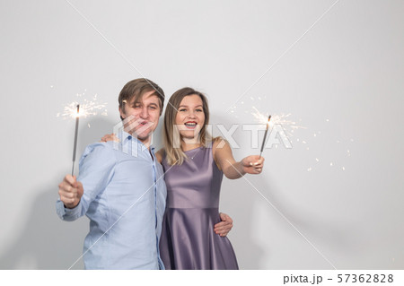 Party, celebration, event and holidays concept - man dressed in blue shirt and woman dressed in Party, celebration, event and holidays concept - man dressed in blue shirt and woman dressed in 57362828