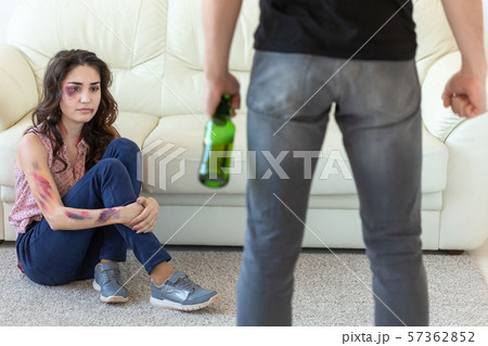 Victim, domestic violence, abuse and alcoholic concept - young couple in problems with drunk Victim, domestic violence, abuse and alcoholic concept - young couple in problems with drunk 57362852