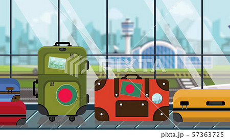 Luggage with Bangladeshi flag stickers on baggage carousel in airport, close-up. Tourism in 57363725