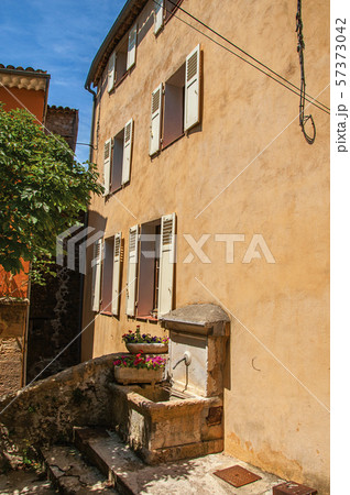Alley with house and fountain in Chateaudouble 57373042