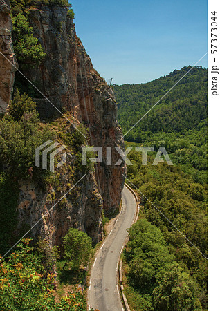 View of green valley and cliff with a road near Chateaudouble View of green valley and cliff with a road near Chateaudouble 57373044