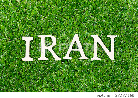 Wood letter in word Iran on green grass background 57377969