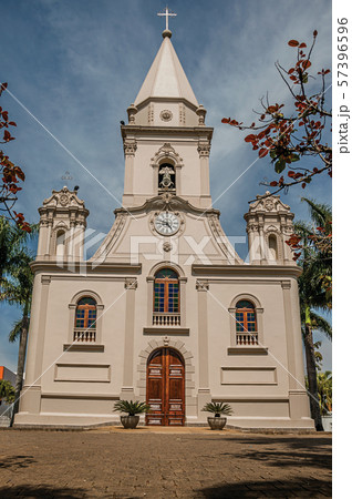 Church facade and belfry in front of a small garden at Sao Manuel Church facade and belfry in front of a small garden at Sao Manuel 57396596