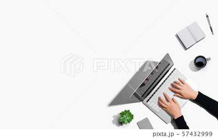 Person using a laptop computer Person using a laptop computer 57432999