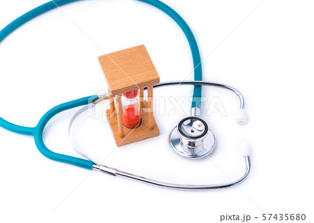 stethoscope and hourglass for doctor and medical nursing people check up healing of patients. 57435680